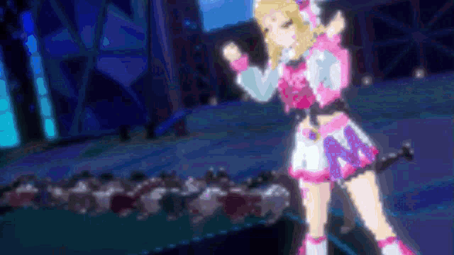 a girl in a pink and white outfit with the letter n on her skirt
