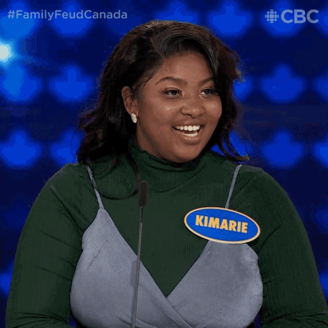 a woman with a name tag that says kimarie is smiling