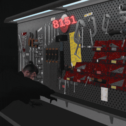 a man stands in front of a wall of tools with the number 8151 on it