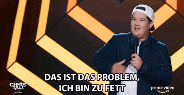 a man stands in front of a microphone and says das ist das problem