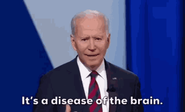 a man in a suit and tie is giving a speech and saying `` it 's a disease of the brain '' .