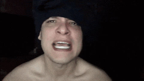 a shirtless man is making a funny face with the words aint nobody got time for that behind him