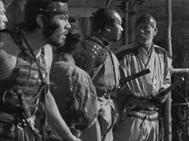 a black and white photo of a group of samurai
