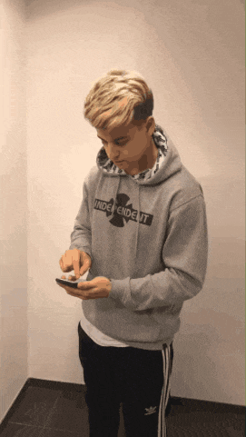 a man wearing a grey hoodie that says independent on it