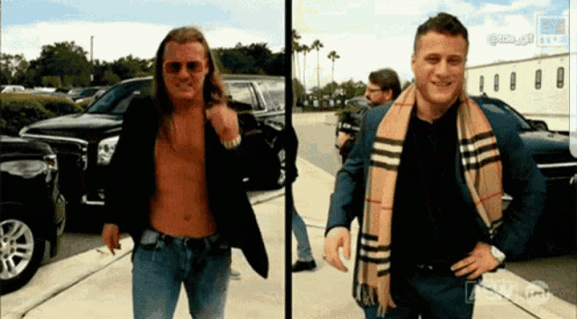 two men standing next to each other with one wearing a scarf