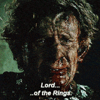 a close up of a man with blood on his face and the words lord of the rings below him
