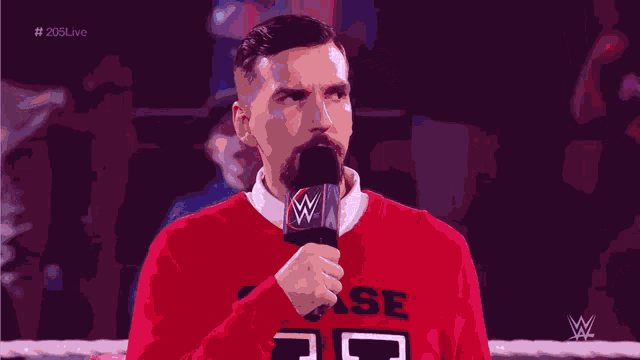 a man in a red sweater with the letter u on the front