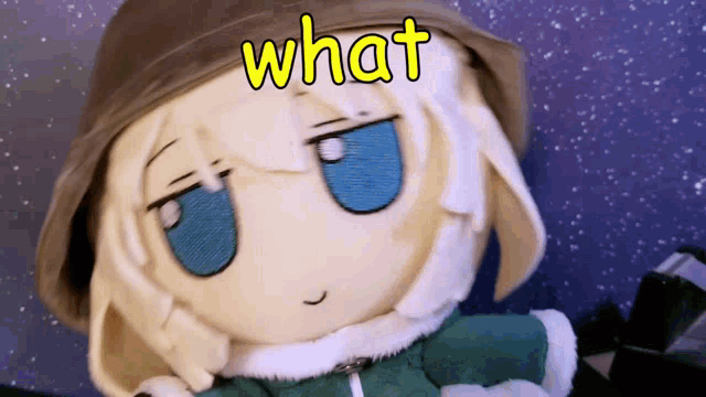 a stuffed doll has the word what written on it