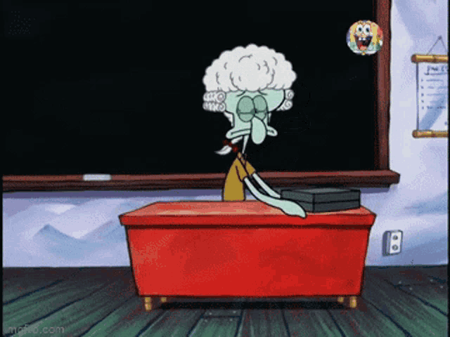 squidward from spongebob sits at a desk in front of a chalkboard
