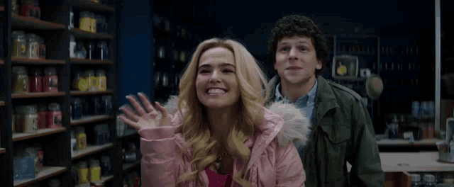 a man and a woman are standing next to each other and smiling