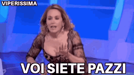 a woman with a plunging neckline and the words voi siete pazzi