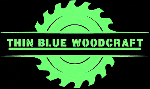 a blue circular saw blade with thin blue woodcraft written below it