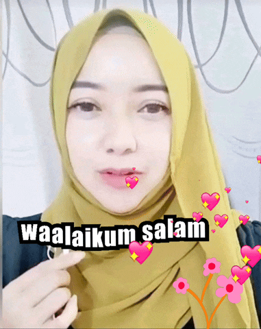 a woman wearing a hijab with the words waalaikum salam written on it