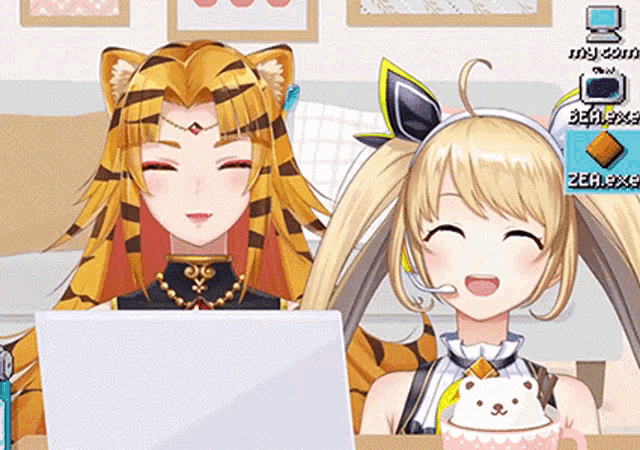 a tiger girl and a blonde girl are sitting in front of a laptop .