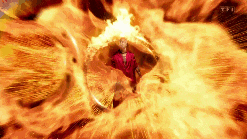 a man in a red suit is surrounded by flames with tfi written on the bottom