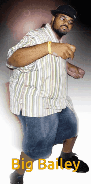 a man in a striped shirt and shorts is standing in front of a sign that says big bailey