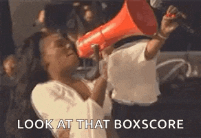 a woman is holding a megaphone in her mouth and shouting into it .