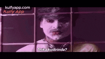 a man with white paint on his face is behind bars and says thika kudirinda .