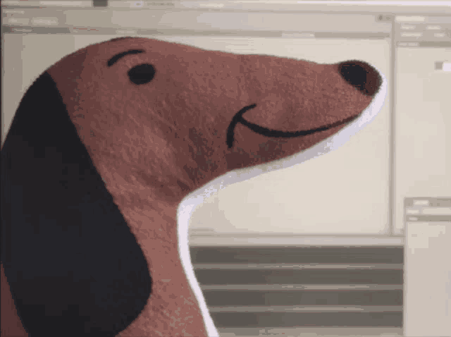 a stuffed dachshund with a smile on its face