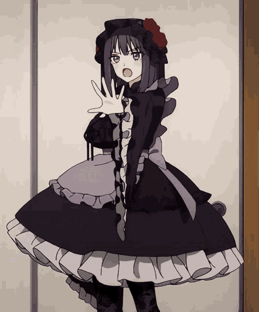 a girl in a black dress with roses on her head