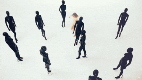 a group of mannequins are standing in a circle and one of them is naked