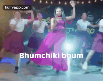 a woman in a pink dress is dancing in front of a group of people with the words bhumchiki bhum written on the bottom