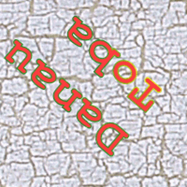a close up of a cracked wall with the words deuard written in red