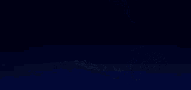 a microphone is sitting on a dark blue surface