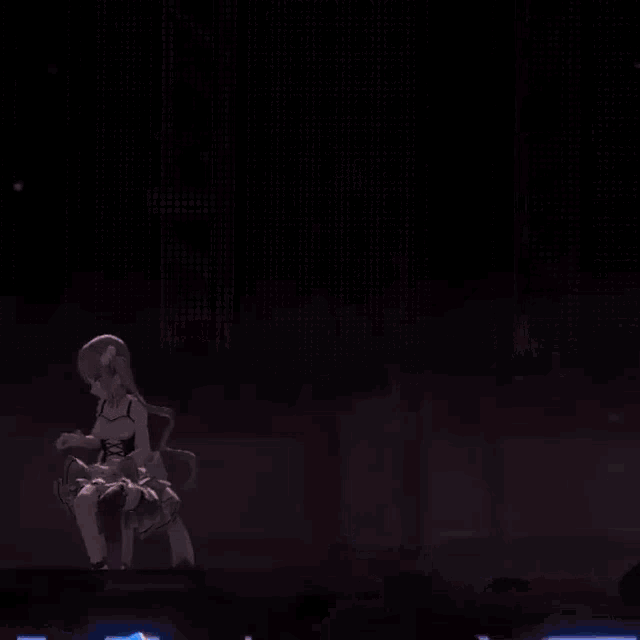 a girl is dancing on a stage in front of a crowd of people holding neon lights .