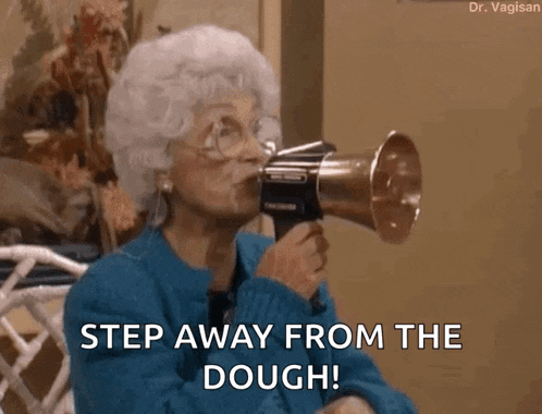 an elderly woman is holding a megaphone in her mouth and saying " step away from the dough "