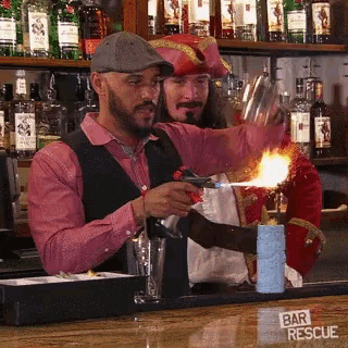 a man in a pirate costume is making a drink at a bar with a sign that says bar rescue