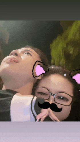 a woman wearing glasses and a mustache looks up at the sky