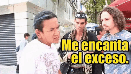 a group of men are standing on a street and one of them says " me encanta el exceso "