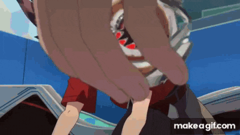 a close up of a person 's hand holding something in their hand .