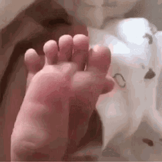 Baby Foot Reflex GIF - Baby Foot Reflex Hold GIFs