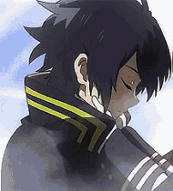 a close up of a person 's face with their eyes closed and a yellow stripe on their collar .