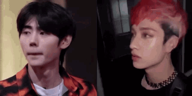 two young men are standing next to each other and one of them has red hair .