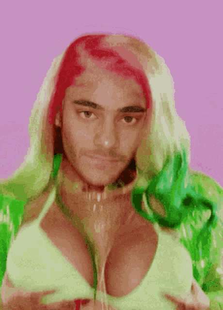 a man with a beard and red hair is wearing a bikini top