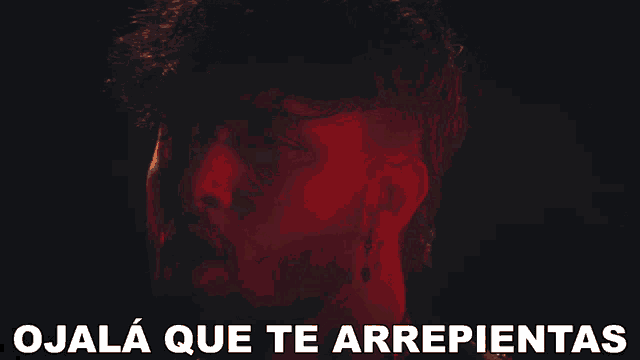 a close up of a man 's face with the words " ojalá que te arrepientas " above him