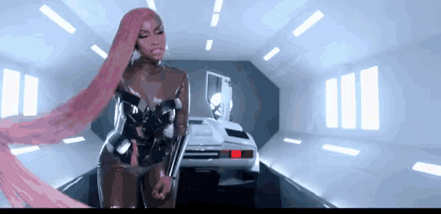 a woman with long pink hair is standing in front of a white car .