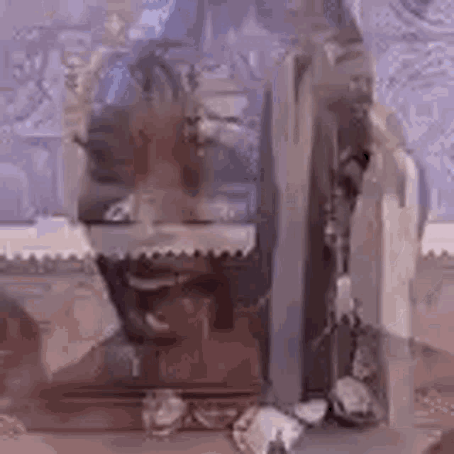 a close up of a person 's face in a coffin with a purple background .