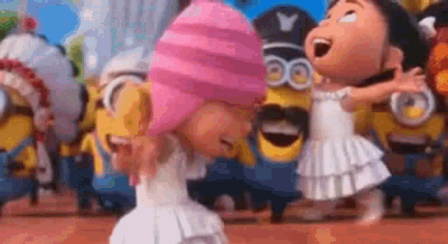 a girl in a pink hat is standing next to a girl in a white dress in front of a crowd of minions .