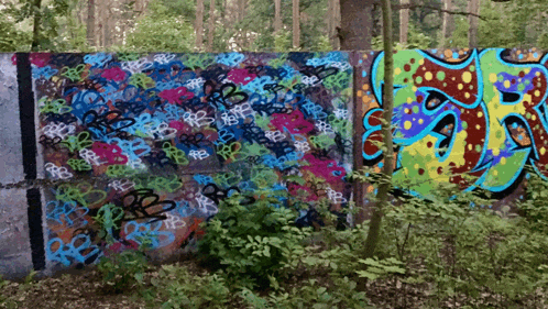 a wall with graffiti on it including the letters rb