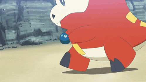 a red and white cartoon character is walking on a sandy beach