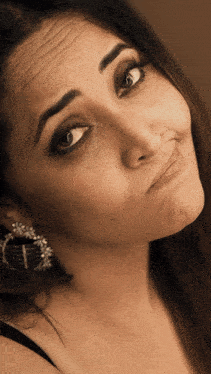 a close up of a woman making a funny face with her mouth open