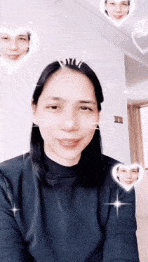 a woman wearing a black sweater with hearts around her