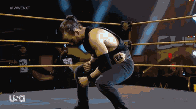 a man in a wrestling ring with a usa logo on the bottom right