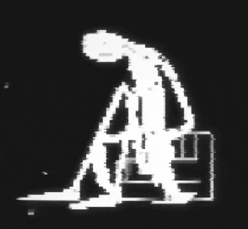 a black and white image of a person in a witch 's hat .