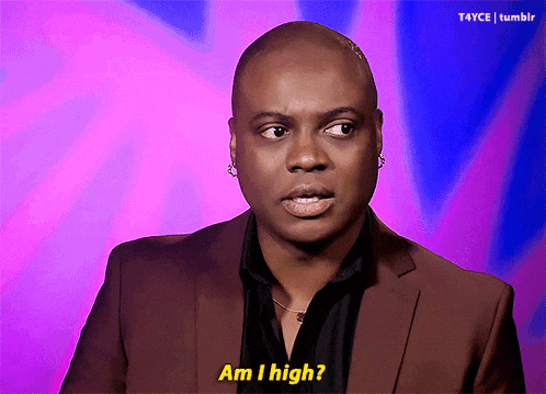 a man in a suit says " am i high " in front of a purple background