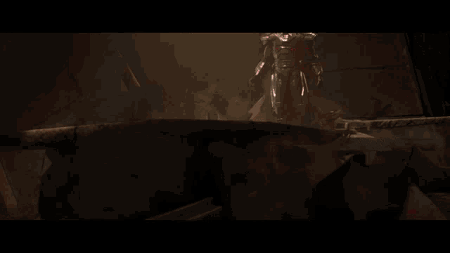 a video game character is holding a red light saber in a dark room